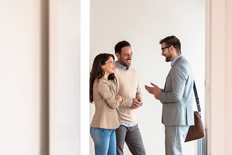 A couple meeting with a real estate agent